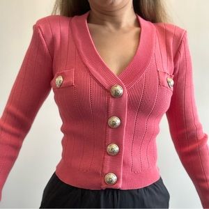 Body hug fitting pink blouse with shoulder pad